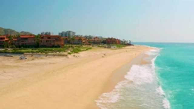 DREAMS BEACH BCS MEXICO-2020: White Capped Blue Waves Wash Against Sandy Shore
