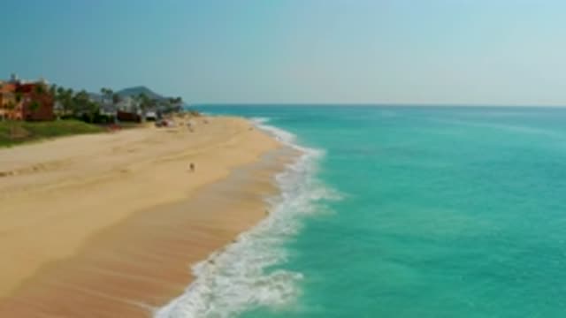 DREAMS BEACH BCS MEXICO-2020: Waves From A Blue Sea Hitting The Empty Sandy Beach
