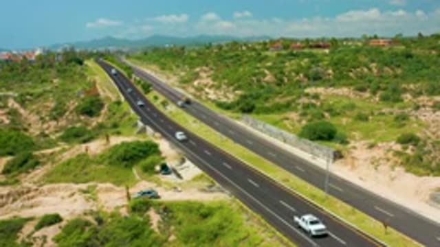 DREAMS BEACH BCS MEXICO-2020: Cars In An Empty Highway Between Hills And Garden