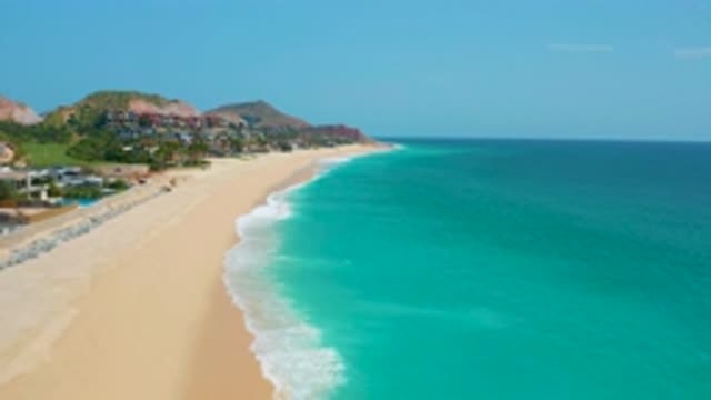 DREAMS BEACH BCS MEXICO-2020: Slowly Panning Drone Footage of Beach Tide and Ocean Surf