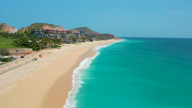 DREAMS BEACH BCS MEXICO-2020: Clear Turquoise Waves Crashing Upon A Sandy Shore