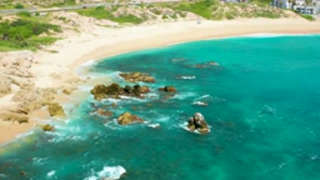 DREAMS BEACH BCS MEXICO-2020: Ocean Waves On A Beach Near A Road And Hotel