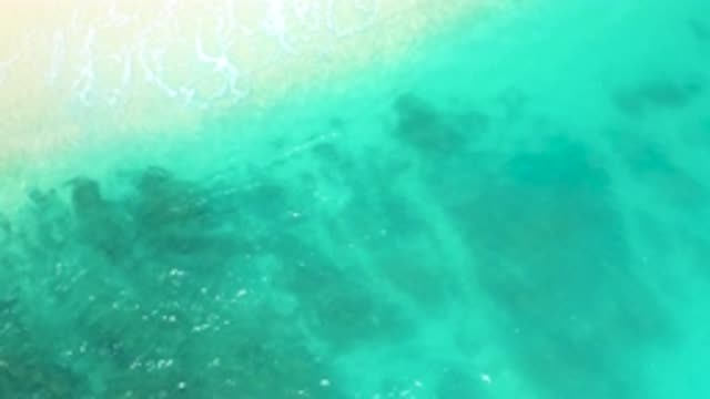 DREAMS BEACH BCS MEXICO-2020: Clear Green Ocean Gently Swaying On The Sand With