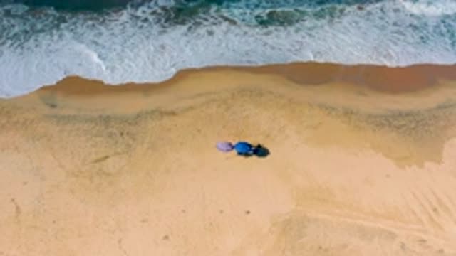 CERRITOS BCS MEXICO-2020: Waves Hit The Shore Almost Touching Two Umbrellas