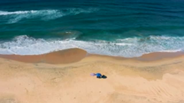 CERRITOS BCS MEXICO-2020: The Ocean Splashing Up Onto The Sandy Beach During A