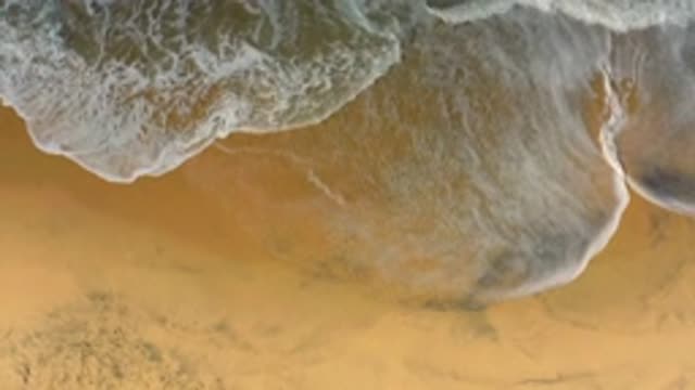 CERRITOS BCS MEXICO-2020: Aerial View Of Pale Blue Seafoam Waves Lapping On Warm