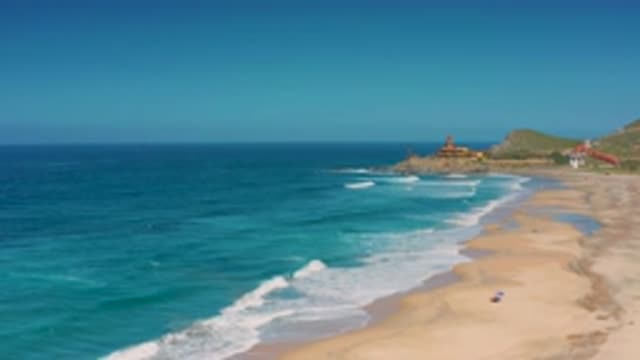 CERRITOS BCS MEXICO-2020: A Beautiful Blue Ocean Moving Slowly Across A Wide Beach
