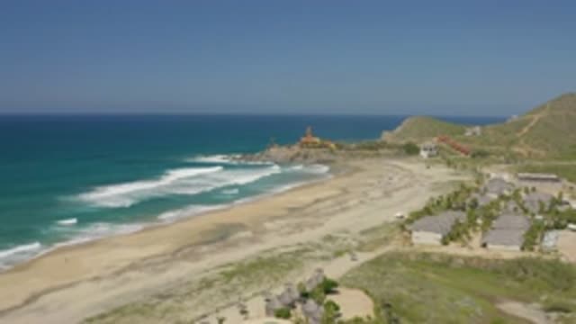 CERRITOS BCS MEXICO-2020: Tidal Wave Blue Sky and Sea on Beach with Buildings