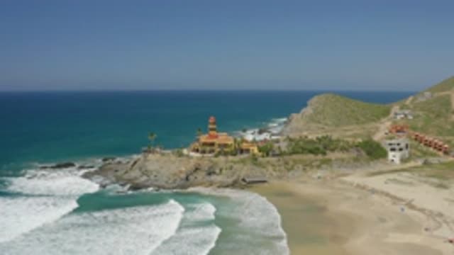 CERRITOS BCS MEXICO-2020: Waves Crash On Beach As Camera Pans Towards Lighthouse