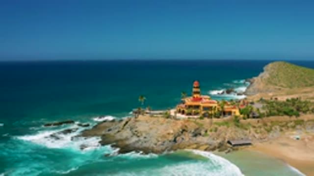 CERRITOS BCS MEXICO-2020: Red Domed Building On Edge Of Rocky Shore Looks Out