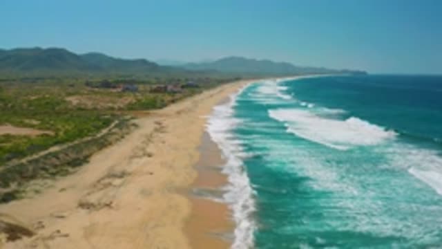 CERRITOS BCS MEXICO-2020: Turquoise Waves Crashing On Rocky Shoreline