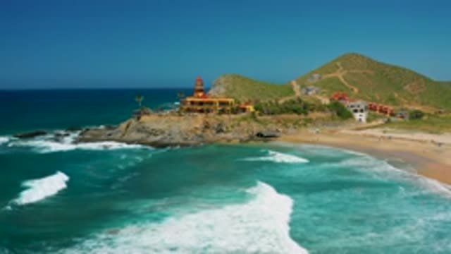 CERRITOS BCS MEXICO-2020: Tall Mountains And Big Building Near Sea Shore Green