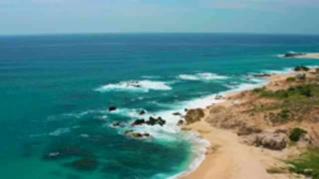 SECRETS MARQUIS LOS CABOS MEXICO-2020: Ocean Waves Wash Up On Rocky Shore With