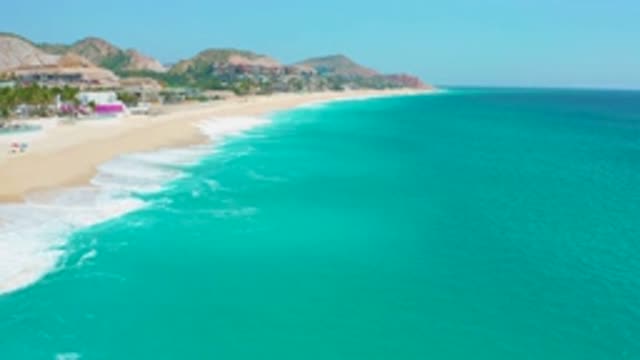 SECRETS MARQUIS LOS CABOS MEXICO-2020: Ocean Waves Breaking Onto A Sandy Shore
