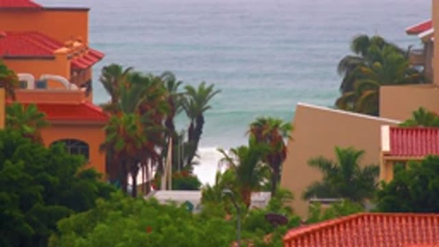 SAN JOSE DEL CABO BCS MEXICO-2020: Bright Orange And Red Buildings Framing A