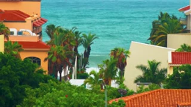 SAN JOSE DEL CABO BCS MEXICO-2020: Bright Blue Waves Crash On Sandy Beach Lined