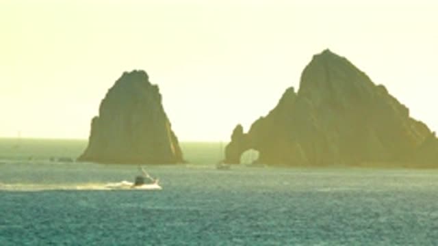 CABO SAN LUCAS MEXICO-2020: Two Bi Hard Rocks Standing In The Center Of The Sea