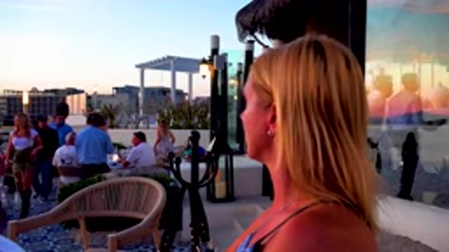 CABO SAN LUCAS MEXICO-2020: A Blond Haired Woman Looking Around A Crowded Place
