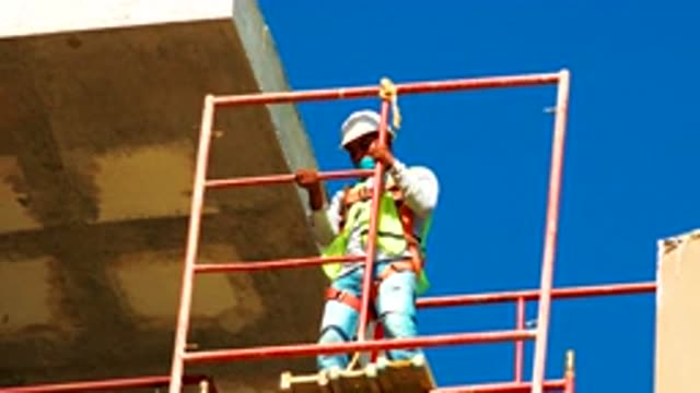 CABO SAN LUCAS MEXICO-2020: Worker Fixing The Grill On Over Roof Which Is