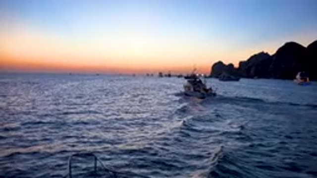 CABO SAN LUCAS MEXICO-2020: Numerous Small Boats Drifting Into A Beautiful Sunset