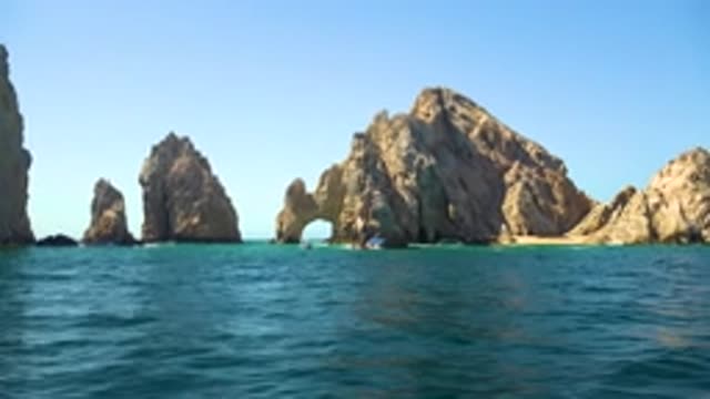 CABO SAN LUCAS MEXICO-2020: Slightly Turbulent Blue Sea Churns With Large Rocks