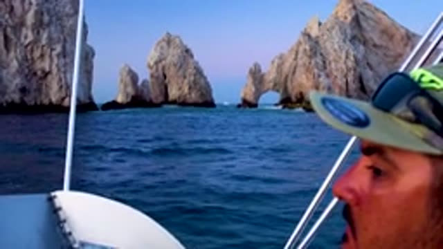 CABO SAN LUCAS MEXICO-2020: Sailing in Ocean Past Arch of Cabo San Lucas in Baja