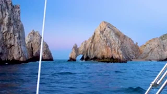 CABO SAN LUCAS MEXICO-2020: Streamer Boat Running The Blue Sea Water Tall Hard