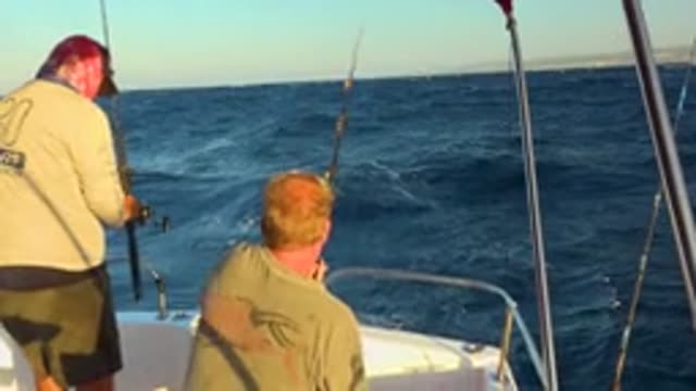 CABO SAN LUCAS MEXICO-2020: Two Old Men Sitting In Boat And Try To Get Fish In
