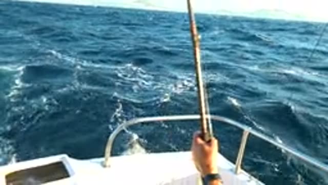 CABO SAN LUCAS MEXICO-2020: Old Man Fishing on Boat in Blue Sea