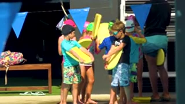 CABO SAN LUCAS MEXICO-2020: Children On The Seaside With Child Surf Planks