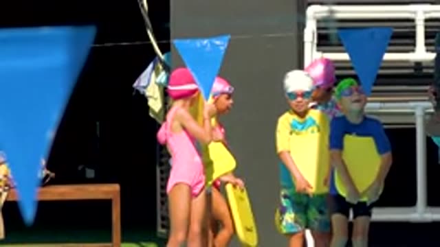 CABO SAN LUCAS MEXICO-2020: Cute Young Boys Wearing Glasses Keeping Yellow Device