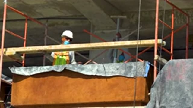 CABO SAN LUCAS MEXICO-2020: Construction Man Lining Up and Taking a Piece of Wood