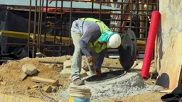 CABO SAN LUCAS MEXICO-2020: A Construction Worker Chiseling Concrete Hole As