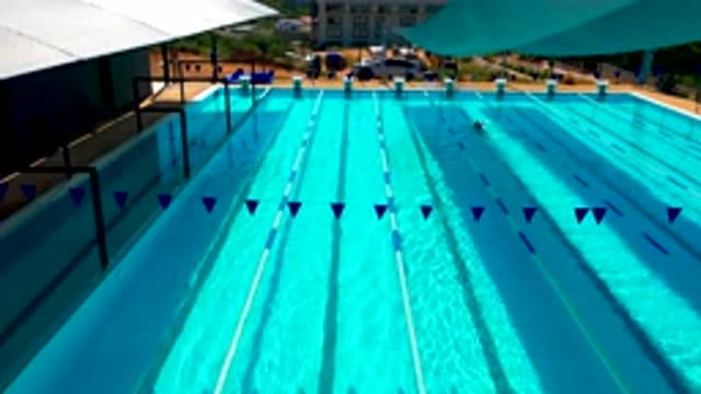 CABO SAN LUCAS MEXICO-2020: Person Swimming Alone in Resort Pool