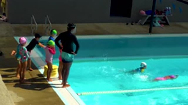 CABO SAN LUCAS MEXICO-2020: Swimming Instructor Teaches Children How To Swim