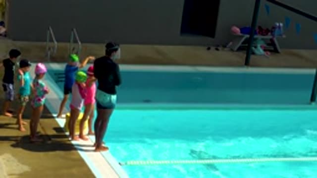 CABO SAN LUCAS MEXICO-2020: Cute Little Children And Coach Wearing Black Top