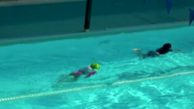 CABO SAN LUCAS MEXICO-2020: Young Child Practices Swimming Underwater in Pool
