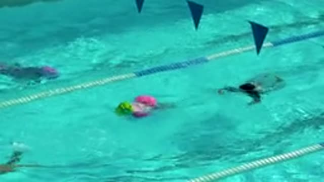 CABO SAN LUCAS MEXICO-2020: Children In Colorful Swimsuits Swimming In A