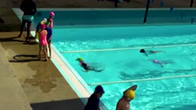 CABO SAN LUCAS MEXICO-2020: Children Climbing Out Of Swimming Pool At End Of Lesson