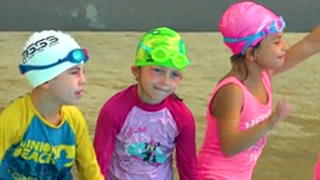 CABO SAN LUCAS MEXICO-2020: Girls And A Boy Wearing Swimsuits Swim Caps And Swim