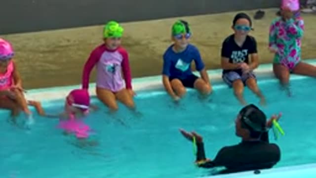 CABO SAN LUCAS MEXICO-2020: Children Sitting On The Edge Of A Pool Splashing And Playing