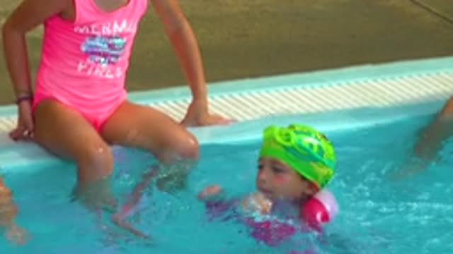 CABO SAN LUCAS MEXICO-2020: A Girl Dressed In A Pink Swimming Suit And Swimming