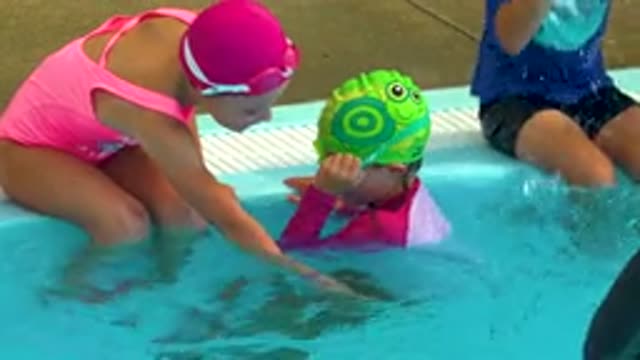 CABO SAN LUCAS MEXICO-2020: Girl Wearing Pink Swimming Suit Boy With Green Glass