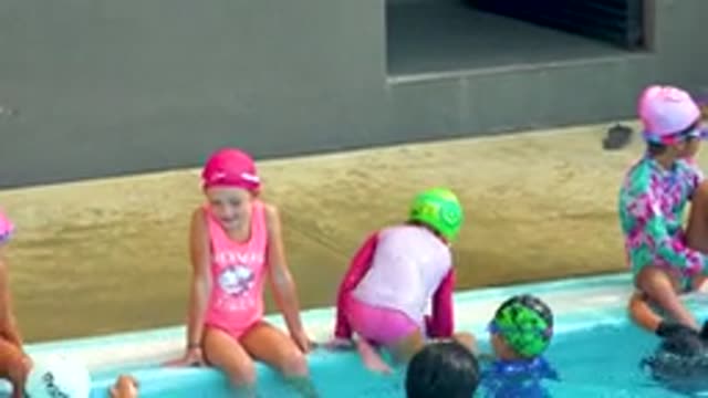 CABO SAN LUCAS MEXICO-2020: Child Coming Out Of Pool To Sit Next To Her Friend