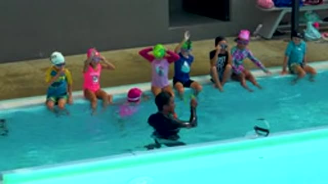 CABO SAN LUCAS MEXICO-2020: Cute Young Boys And Girls Sitting In The Swimming Pool