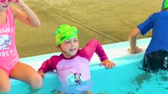 CABO SAN LUCAS MEXICO-2020: Three Young Children Sitting On The Edge Of A Pool
