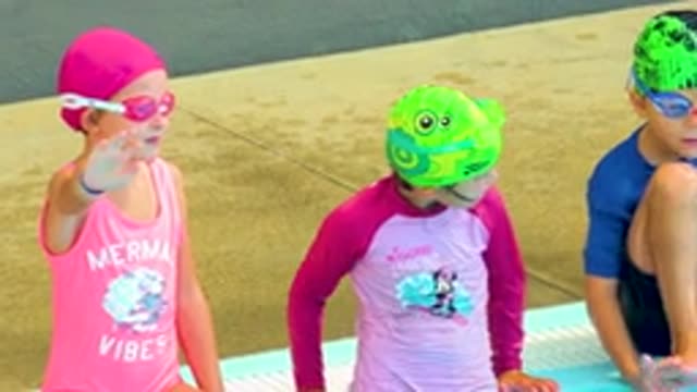 CABO SAN LUCAS MEXICO-2020: Children In Swimsuits Sitting On The Edge Of Pool