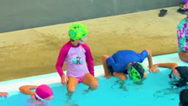 CABO SAN LUCAS MEXICO-2020: Kids Learn To Swim In Swimming Pool By Trainer