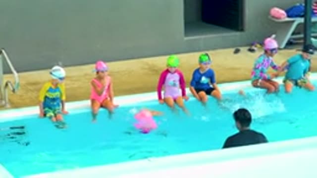 CABO SAN LUCAS MEXICO-2020: Kids At The Poolside Playing And Swimming With An
