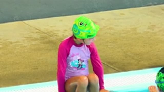 CABO SAN LUCAS MEXICO-2020: A Child Finishes Swimming At A Pool And Sits
